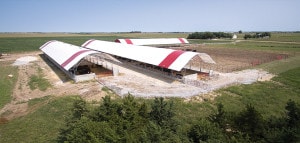 three fabric covered calving under roof buildings