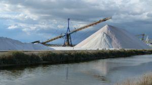 Photo of a pile of salt to be stored in salt storage building